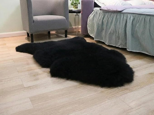 Woolous Black Sheepskin Rug, Genuine New Zealand Lambskin Wool, Real Sheep Skin Throw for Bedroom, Living Room, Sofa, or Chair (Single Pelt, 2x3 ft)